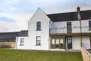 Photograph of Ardbeg Distillery, Seaview Cottage.